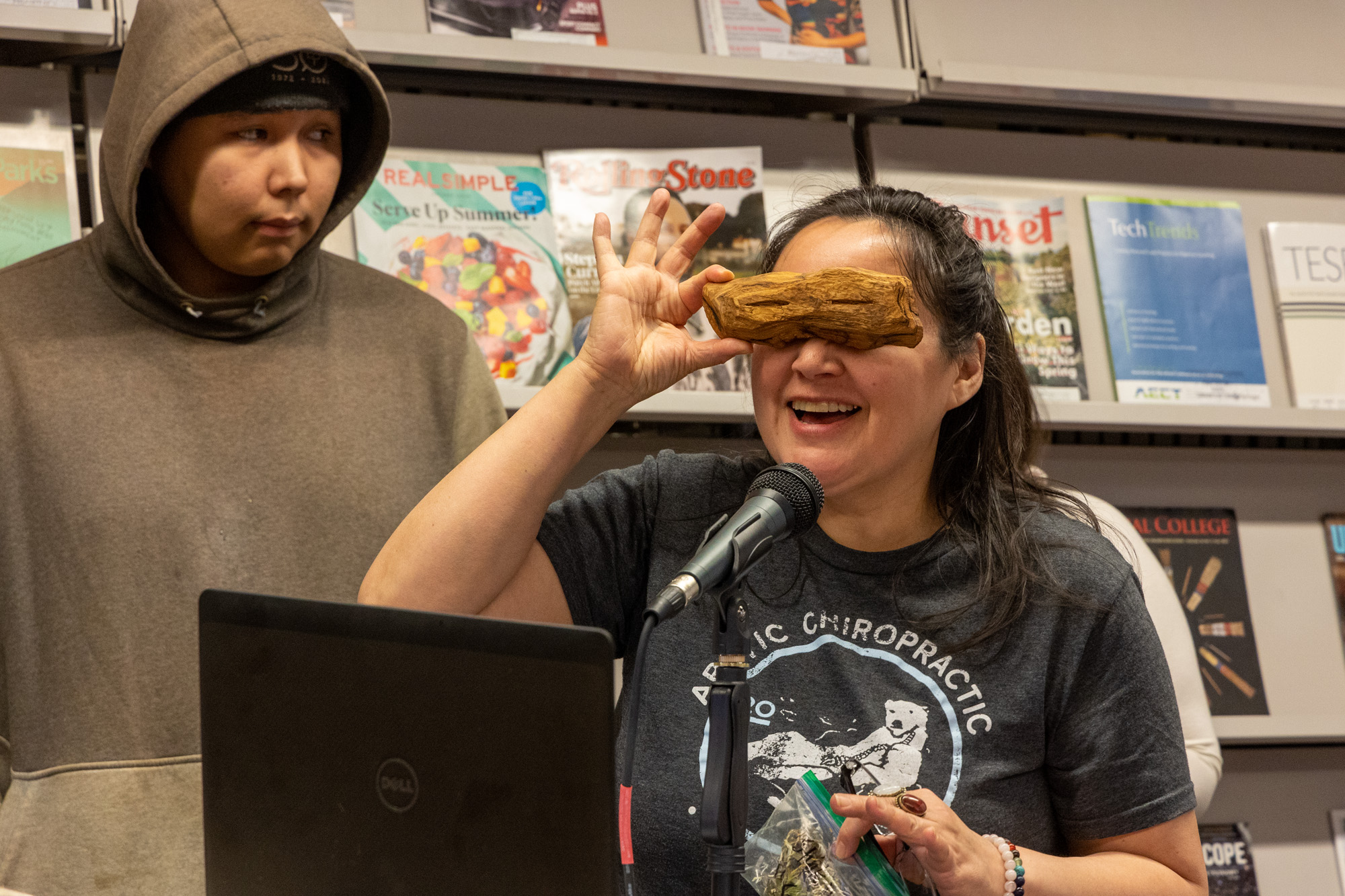 student holds up snow googles