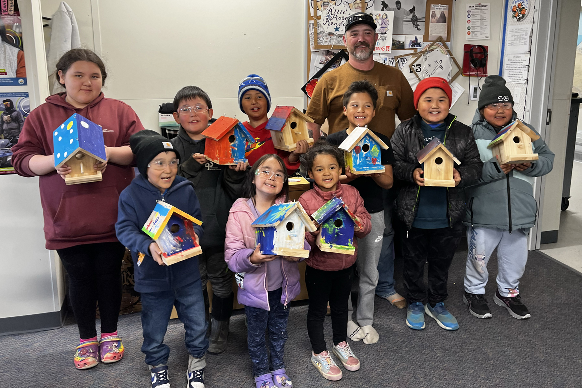 Summer camp students with homemade bird houses