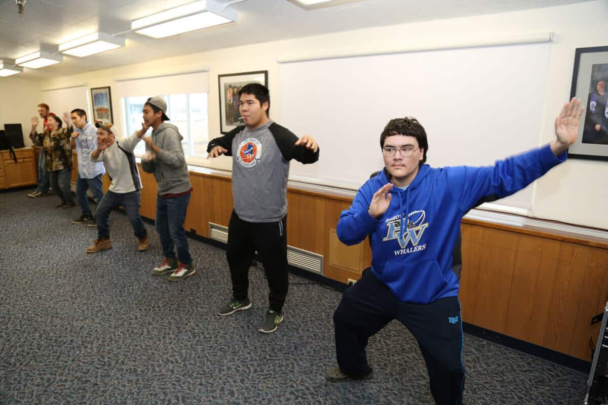 Students practicing traditional dance at Iḷisaġvik College. (1)