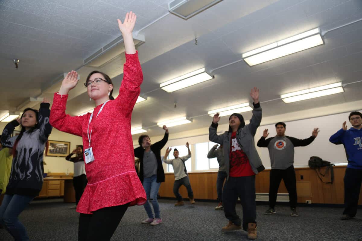 Students practicing traditional dance at Iḷisaġvik College. (2)