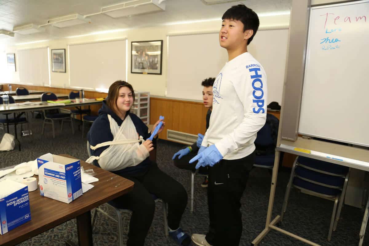 Students practicing first aid.