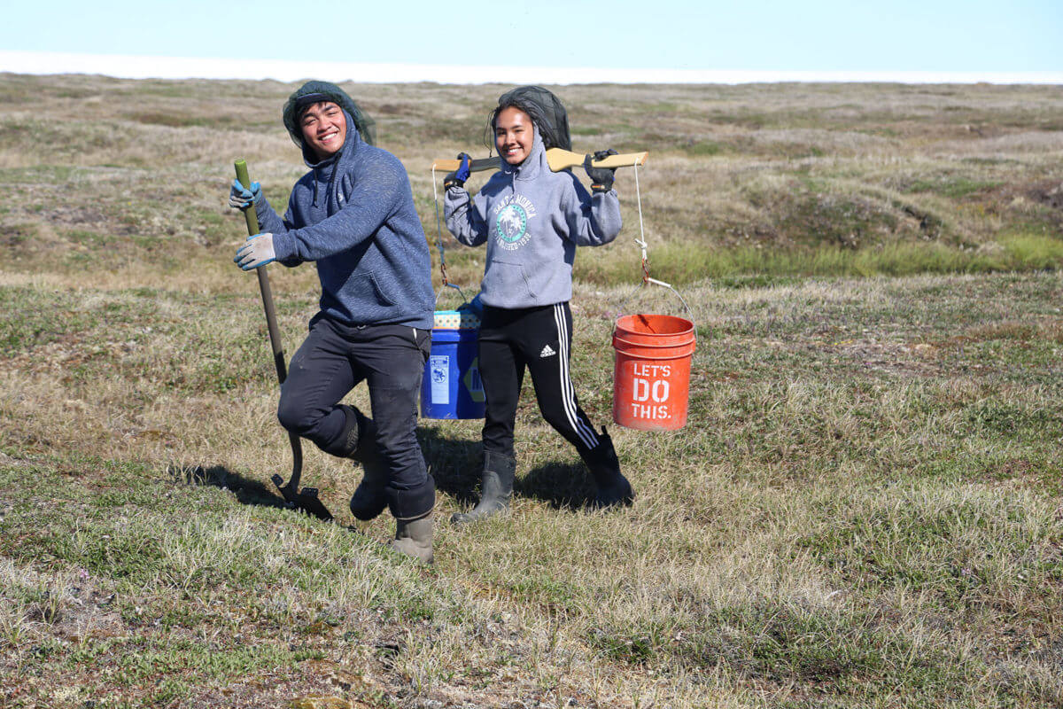 Students collecting samples on the tundra.