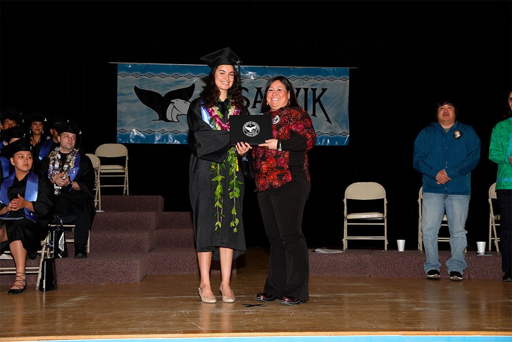 Graduate receiving diploma